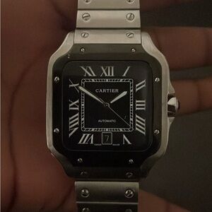 Cartier Black and Silver Timepiece